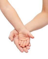 Image showing close up of woman and little child hands together