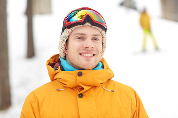 Image showing happy young man in ski goggles outdoors