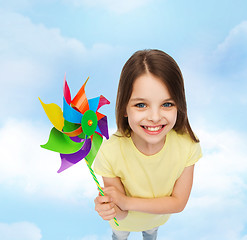 Image showing smiling child with colorful windmill toy