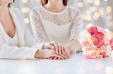 Image showing close up of happy lesbian couple with flowers