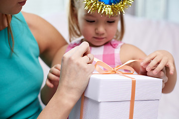 Image showing happy mother and little girl with gift box