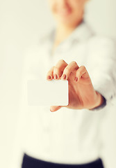 Image showing businesswoman showing blank card