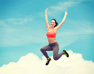 Image showing sporty teenage girl jumping in sportswear