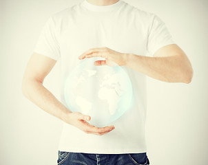 Image showing man hands holding sphere globe