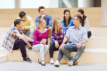 Image showing group of smiling students with paper coffee cups