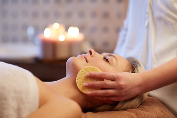 Image showing close up of woman having face massage in spa