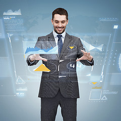 Image showing businessman working with virtual screen