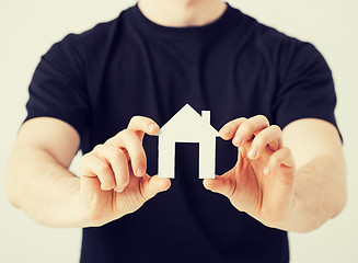 Image showing man hands holding paper house