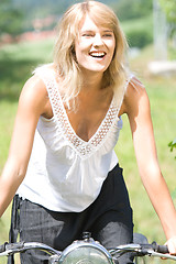 Image showing Young woman on motorcycle