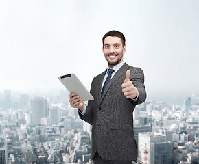 Image showing smiling buisnessman with tablet pc computer