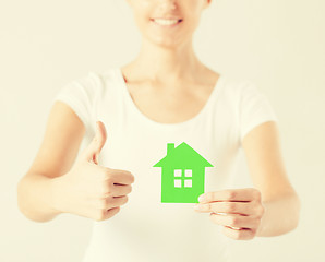 Image showing woman hands holding green house