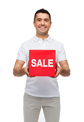 Image showing smiling man with red sale sigh