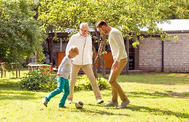 Image showing happy family playing football outdoors