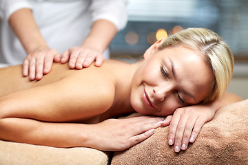 Image showing close up of woman lying and having massage in spa