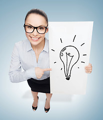 Image showing smiling businesswoman with white board