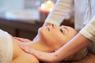 Image showing close up of woman lying and having massage in spa