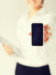 Image showing woman hand with smartphone