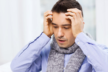 Image showing close up of ill man with flu and headache at home