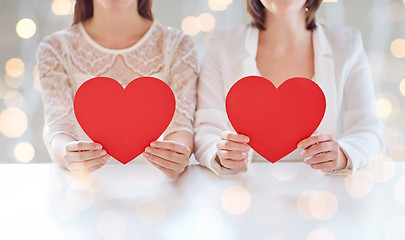 Image showing close up of happy lesbian couple with red hearts