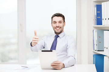 Image showing smiling businessman with tablet pc and documents