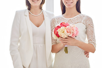 Image showing close up of happy lesbian couple with flowers