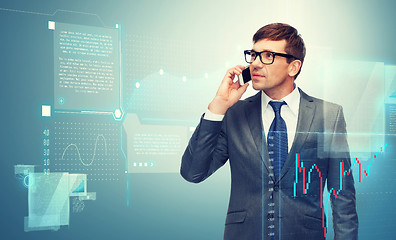 Image showing buisnessman with cell phone and forex chart