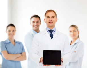 Image showing smiling male doctor with tablet pc