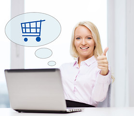 Image showing happy businesswoman with laptop showing thumbs up