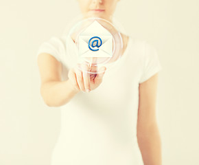 Image showing woman pressing virtual button with e-mail icon