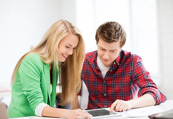 Image showing students looking at tablet pc at school