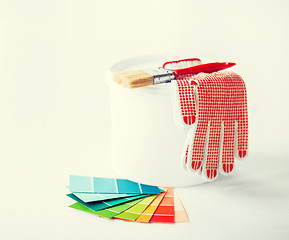 Image showing paintbrush, paint pot, gloves and pantone samplers