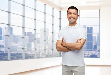 Image showing smiling man in white t-shirt over office or home