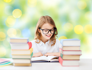 Image showing happy student girl reading book at school