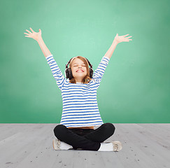 Image showing happy girl with headphones listening to music