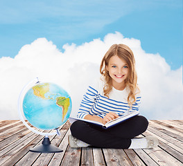 Image showing girl with globe and book