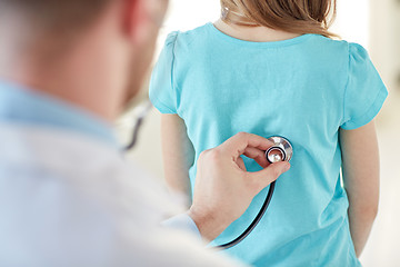 Image showing close up of girl and doctor on medical exam