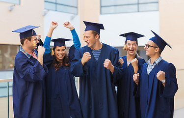 Image showing group of smiling students in mortarboards