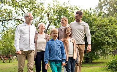 Image showing happy family in front of house outdoors