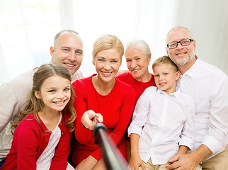 Image showing smiling family making selfie at home