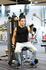 Image showing man exercising on gym machine