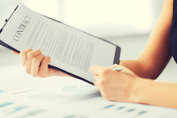 Image showing woman hand signing contract paper