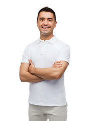 Image showing smiling man in white t-shirt with crossed arms