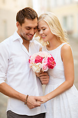 Image showing couple with flowers in the city