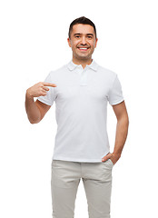 Image showing smiling man in t-shirt pointing finger on himself