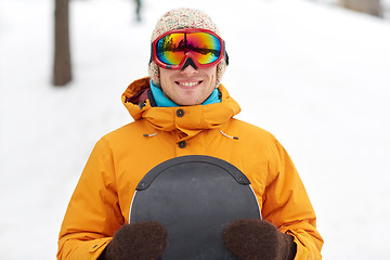 Image showing happy young man in ski goggles outdoors