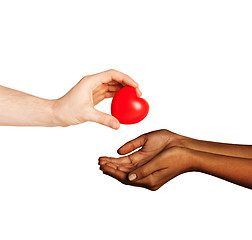 Image showing woman and man hands with red heart