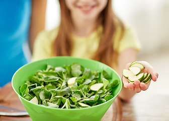 Image showing close up of happy family making dinner in kitchen