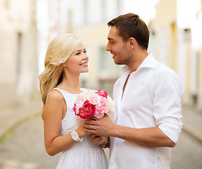 Image showing couple with flowers in the city