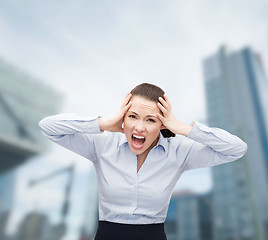 Image showing angry screaming businesswoman outdoors