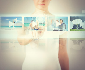 Image showing woman pressing button on virtual screen